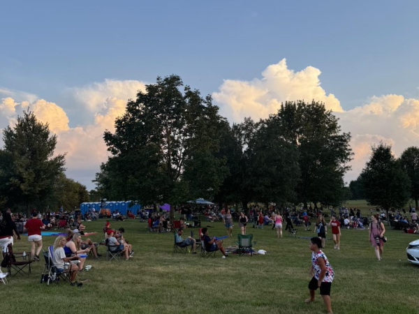 Crowds gather on the lawn at The Hayward Minton Thunderfest, enjoying the summer evening ahead of the fireworks show.
