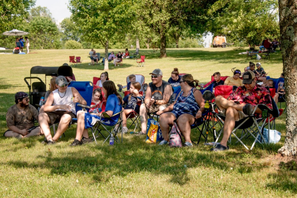 Families relax under the shade, enjoying the afternoon at The Hayward Minton Thunderfest.